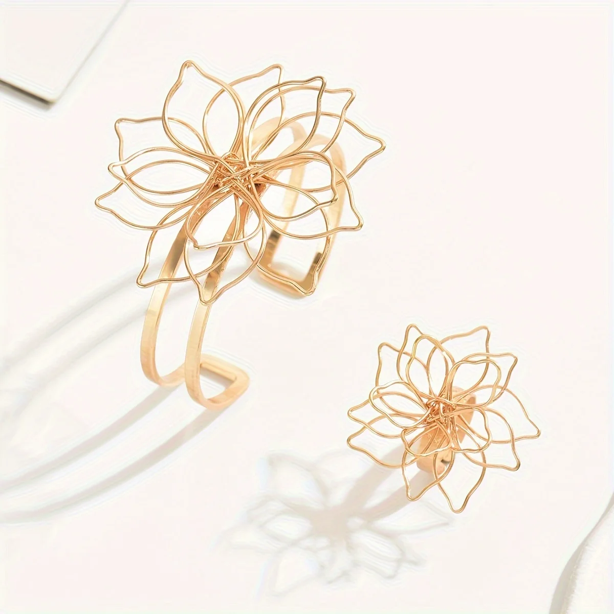 

Lxalry Fashion Women's Jewelry Set: Elegant Geometric Lattice Flower Ring, Double-Layer Smooth Open Adjustable Bracelet