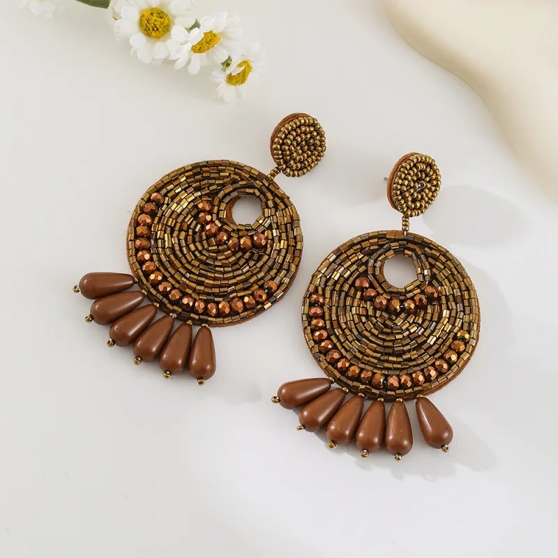 Beaded earrings Sewing Circle Bohemia Hollowed-out Hand-woven Alloy Female Trend Simple Rice bead earrings