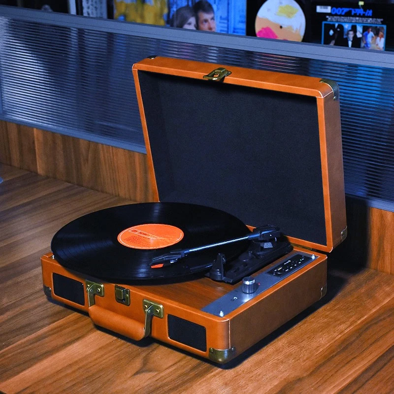 

vinyl record player, retro phonograph, audio bluetooth speaker, living room ornament, portable leather case.