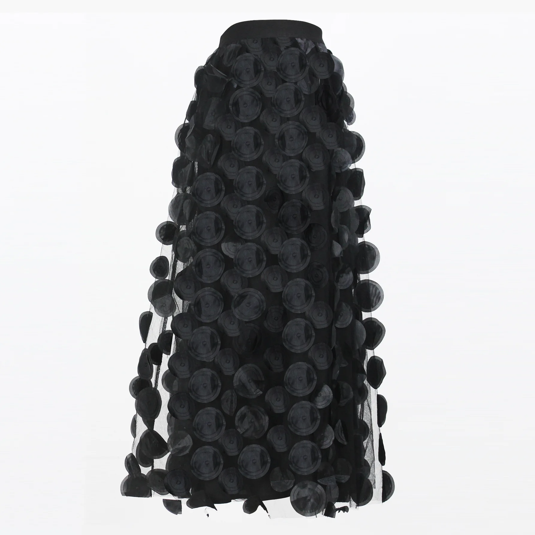 Long solid-color midi skirt with three-dimensional decorative patches and spliced mesh fabric