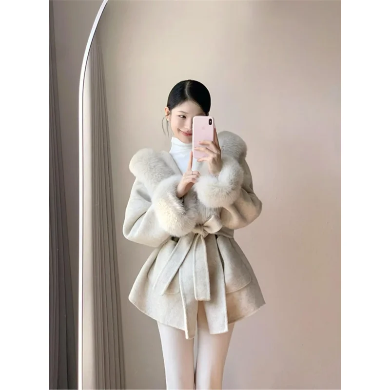 

Женское шерстяное пальто Ele 2026: Новинка, высококачественное, с меховым поясом, корейский свободный крой, длинный рукав, с капюшоном, однотонное