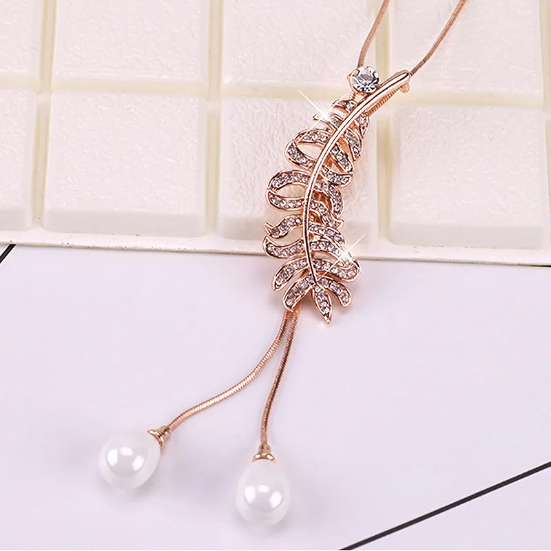 Multi-functional and personalized sweaters, long chain necklaces, and women's feather tassel pendants