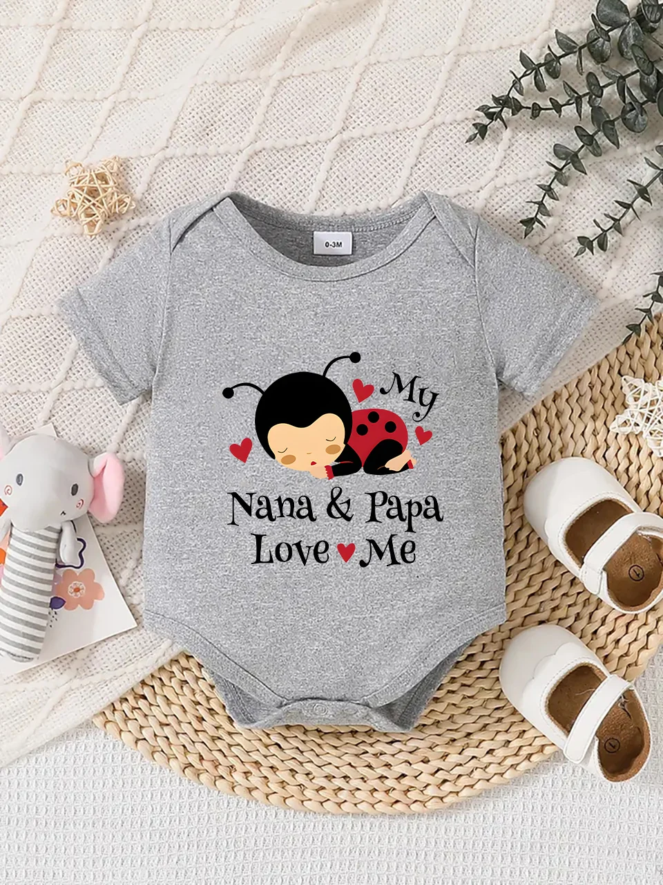 

Playful letter-printed baby short-sleeve triangle bodysuit. Button closure for easy dressing, machine washable