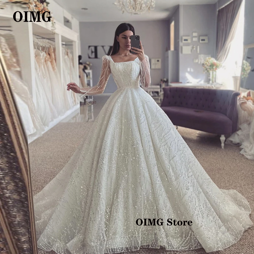 OIMG Vestidos Glitter สายชุดแต่งงานแขนยาวเจียมเนื้อเจียมตัวสแควร์คอ Sparkly Princess ชุดเจ้าสาว Robe De Mariage