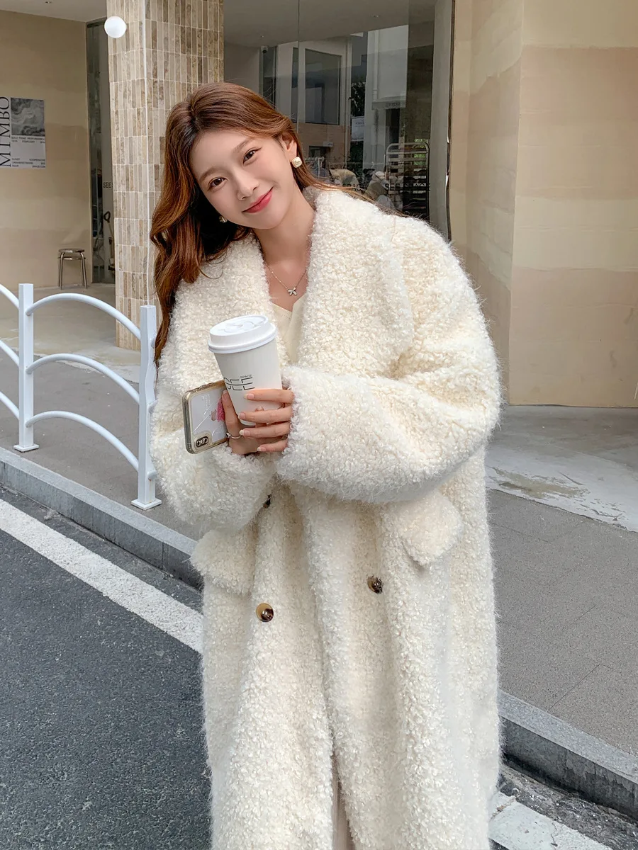 

A new oversized sheepskin fur coat with a long lapel and a thick, fluffy coat for women