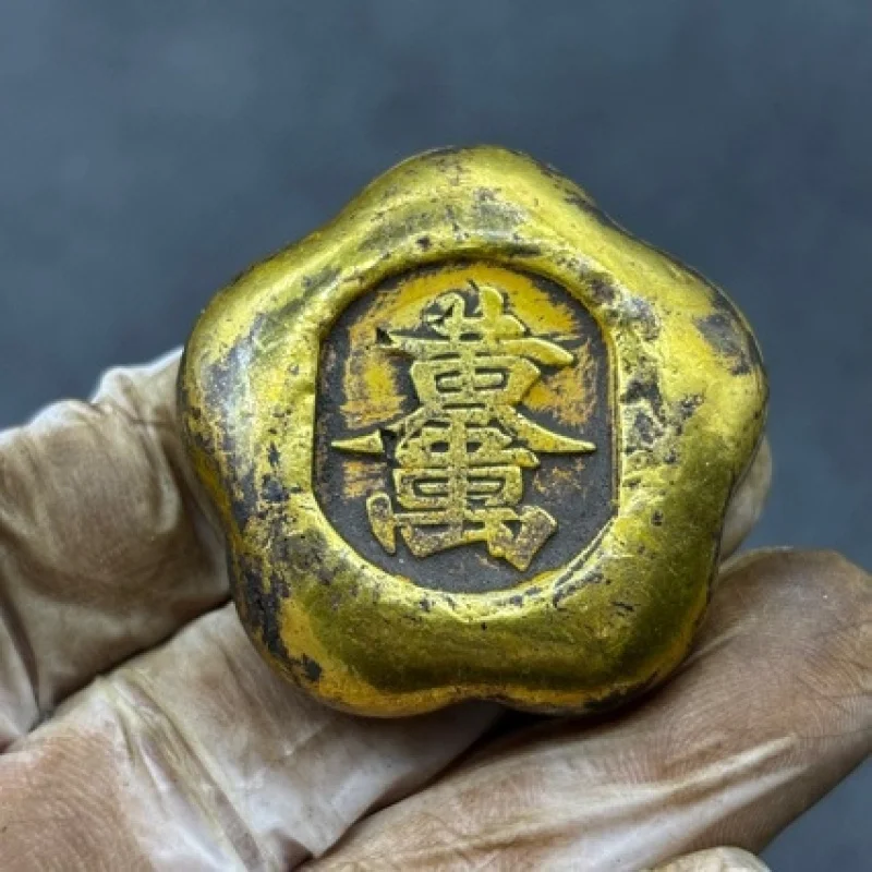 Small yellow fish-shaped ancient copper bar, ingot, block, gold brick, brass artifact for collecting