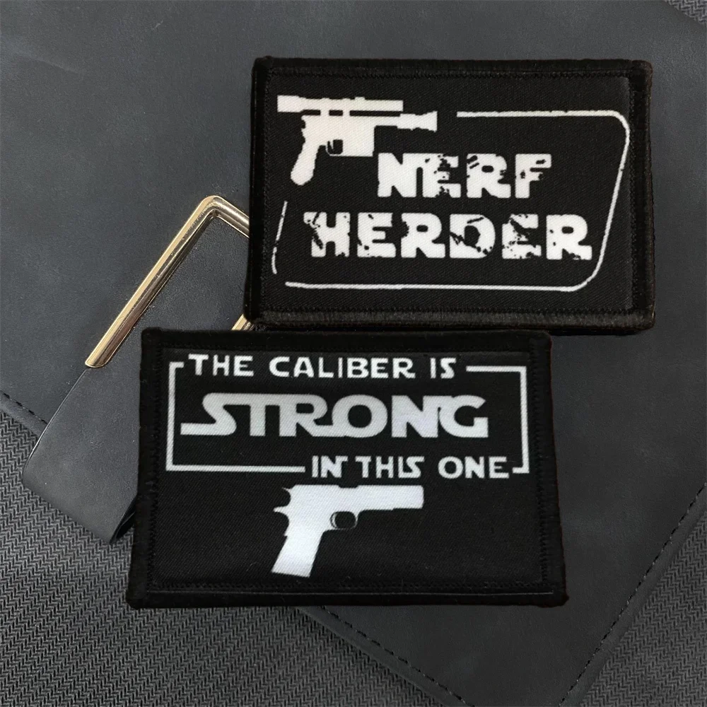 

Nerf Herder Morale Badge Patch Pistol Military Army Tactical Backpack Sticker THE CALIBER IS STRONG IN THIS ONE Hook and Loop