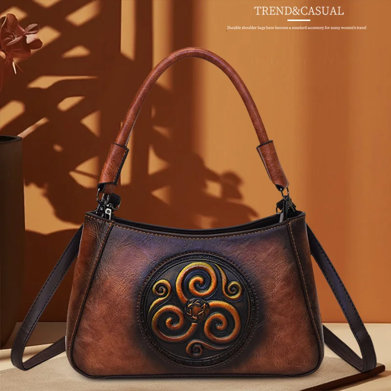 

This retro Chinese ethnic style handbag is a versatile single-shoulder crossbody bag with a light luxury embossed design