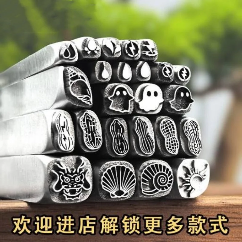 Jewellery stamps, peanut, conch shell and teardrop-shaped steel stamps; gold and silver chasing moulds; gold-smithing tools