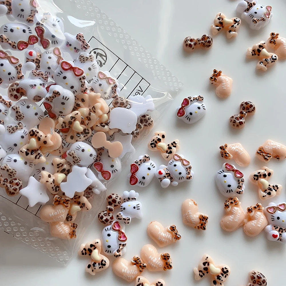 20pcs น่ารักเสือดาวแว่นตากันแดด Hello Kitty เล็บ Charms,ผสมเสือดาวพิมพ์ 3D ริบบิ้นโบว์อุปกรณ์เสริมการ์ตูนตกแต่งเล็บ