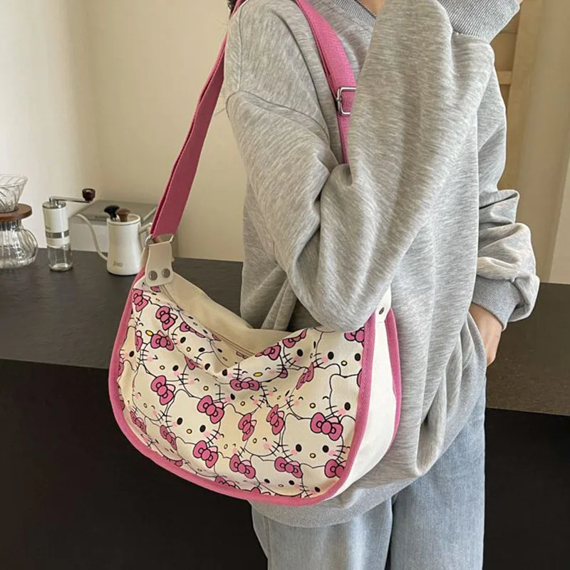 2024 New Sanrio Hello Kittys borsa di tela simpatico cartone animato stampa a schermo intero ragazza cuore Casual Versatile borsa a tracolla giocattoli regali per ragazza