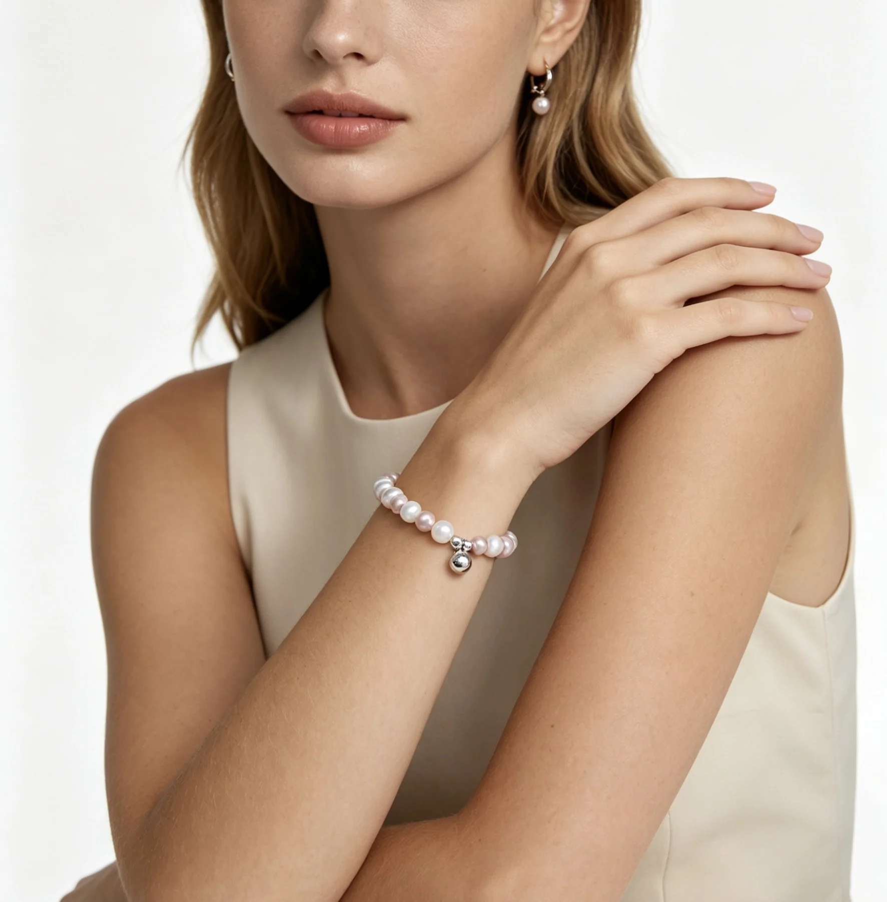 

Adjustable Freshwater Pearl Bracelet with Silver Bell Charm Two-Tone Design