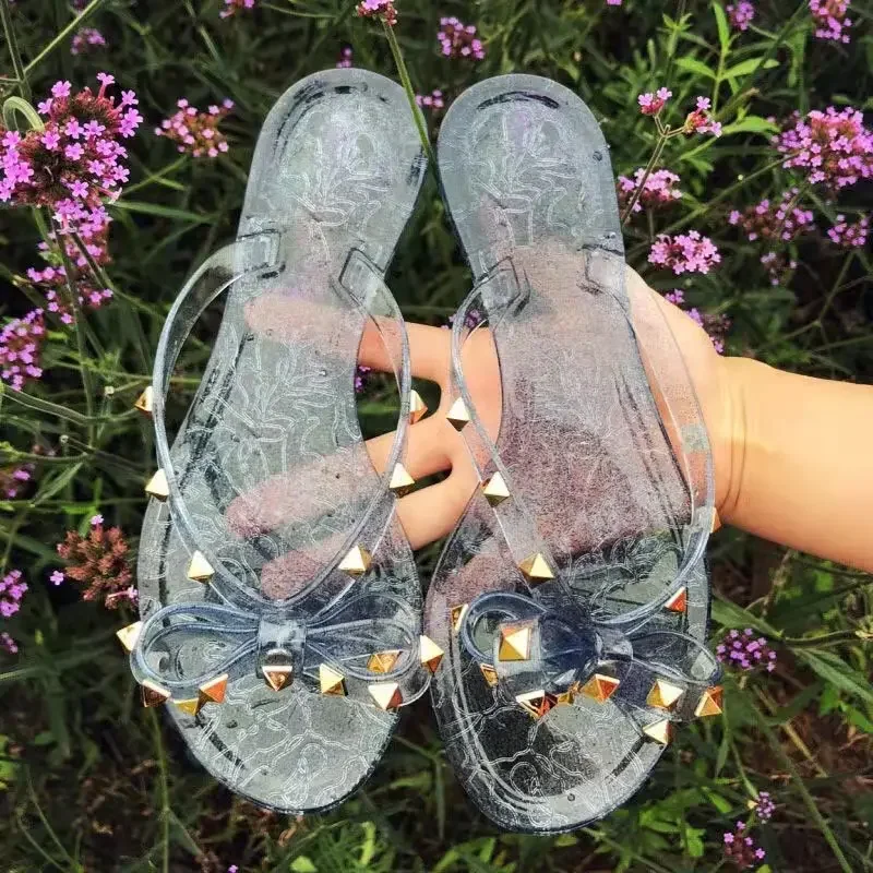 Sandálias planas com rebite para mulheres, chinelos de praia, sapatos de gelatina legal, Big Bow, venda quente, moda verão, tamanho 36-42, 2024