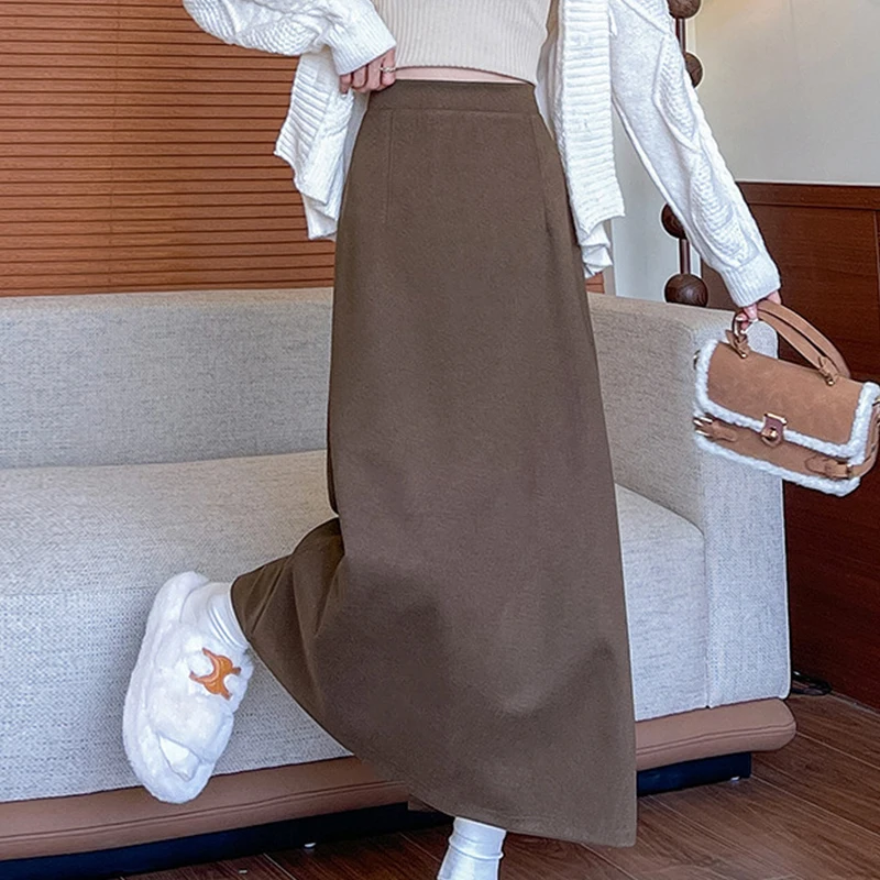 Długie spódnice damskie z wysokim stanem na jesień i zimę 2025, nowe, jednolite, uniwersalne spódnice w kształcie litery A z rozcięciem z tyłu.