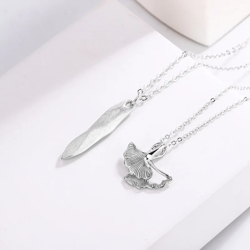 A Pair of Couples Necklace Made of Pure 925 Silver Consist of a Shell-shape Pendant Necklace and a Knife-shape Pendant Necklace