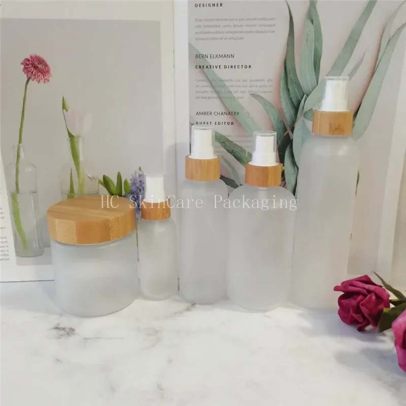 

empty cosmetic packaging bottle frosted/matte plastic bottle with bamboo cap and frosted plastic cream jar，face cream jars