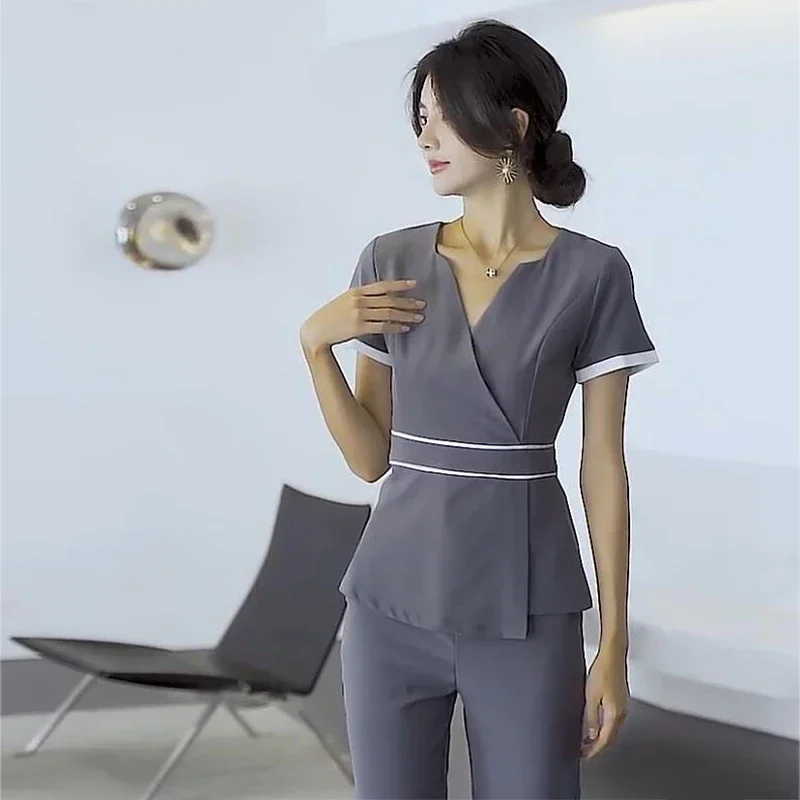 Prezzo all'ingrosso Set per scrub di bellezza Set uniforme da lavoro per hotel femminile Set per scrub Abito per massaggio ai piedi con scollo a V in due pezzi