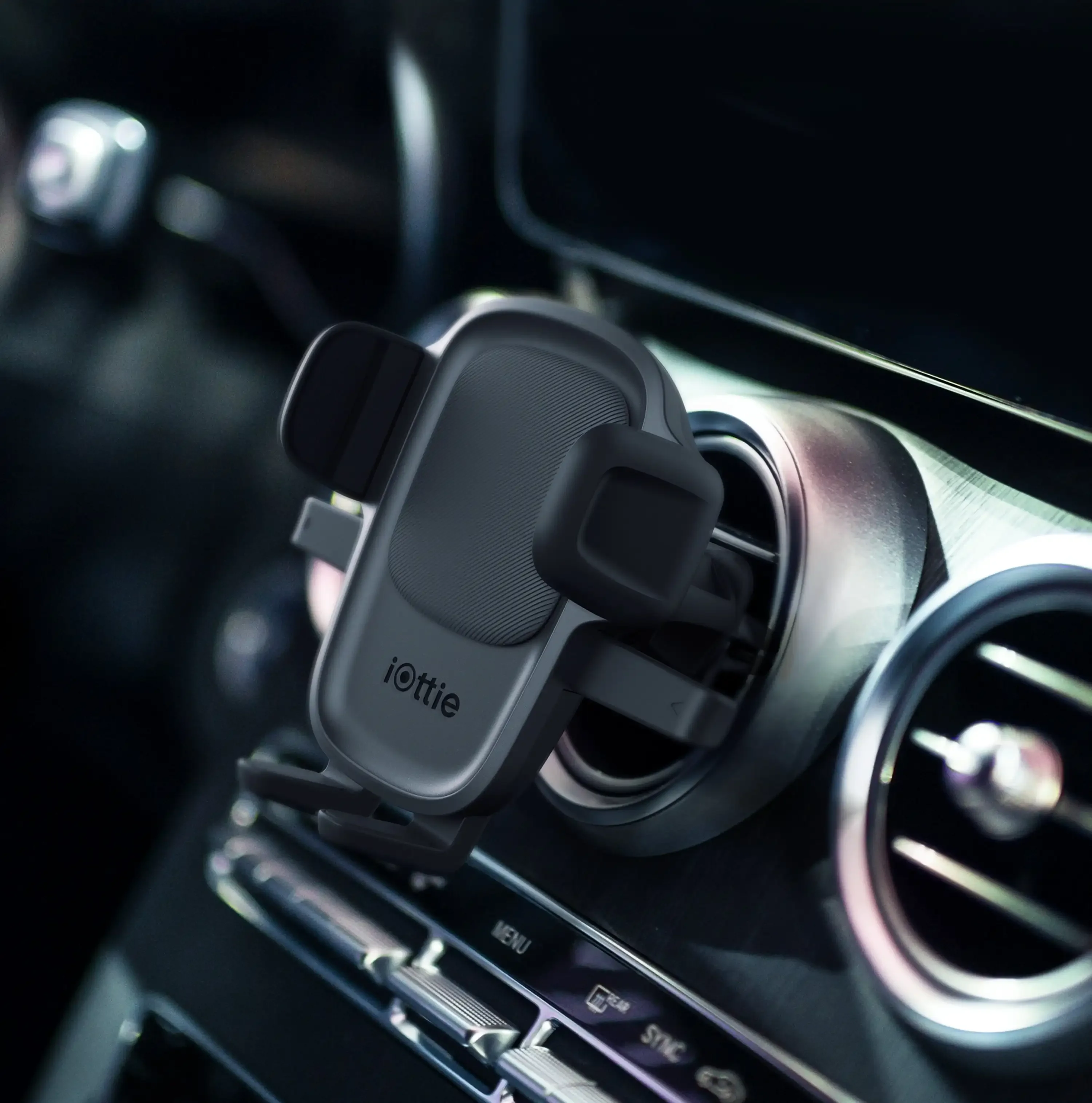 

Air vent car phone holder with one-handed operation, universal compatibility, and magnetic cable organizer.