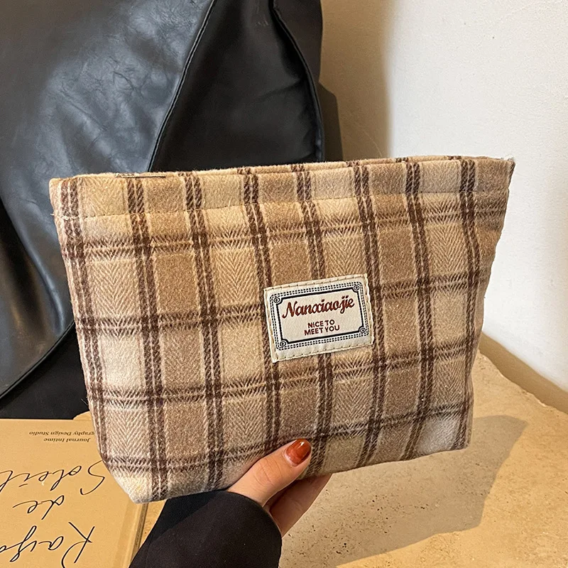 Striped woolen high appearance level hand makeup bag large capacity light and thin students travel to receive toiletry bag