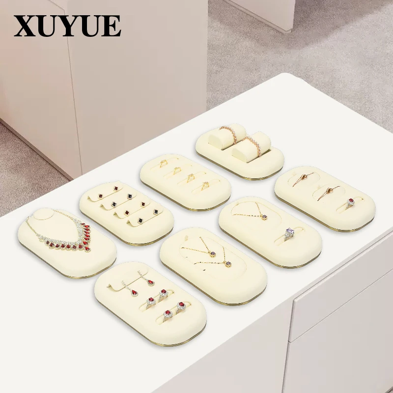 Jewelry counter displays rings, earrings, bracelets, necklaces, trays, jewelry viewing displays, and plates