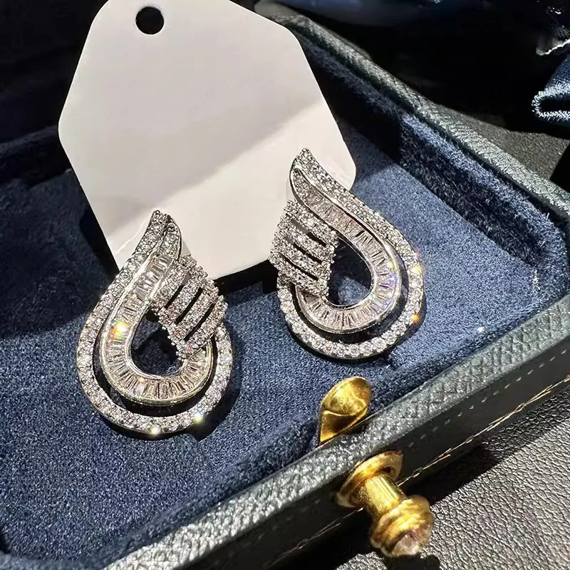High end Shein style earrings for socialites, featuring female water droplet hollow design, with a light luxury urban trend