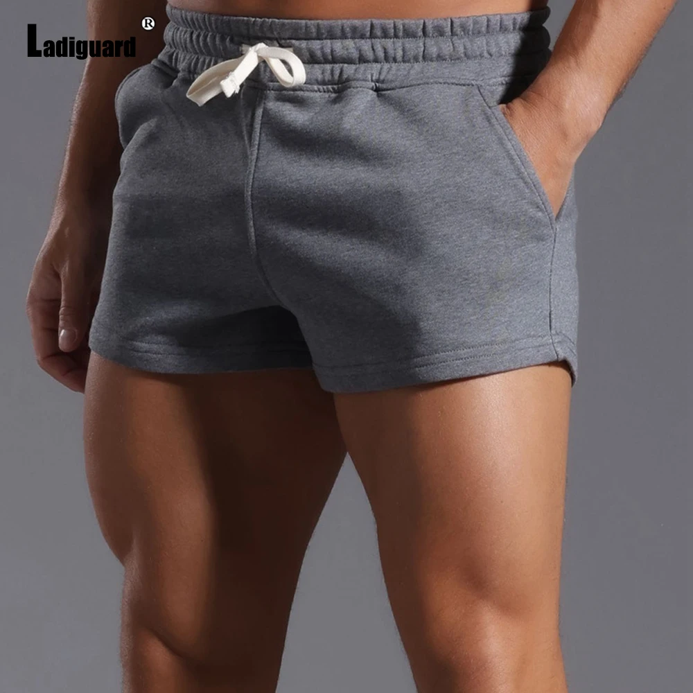 2025 New Summer Casual Running Shorts Men Sexy Elastic Wiast Ultra-shorts Male Stand Pockets Casual Beach Short Pants Gray White