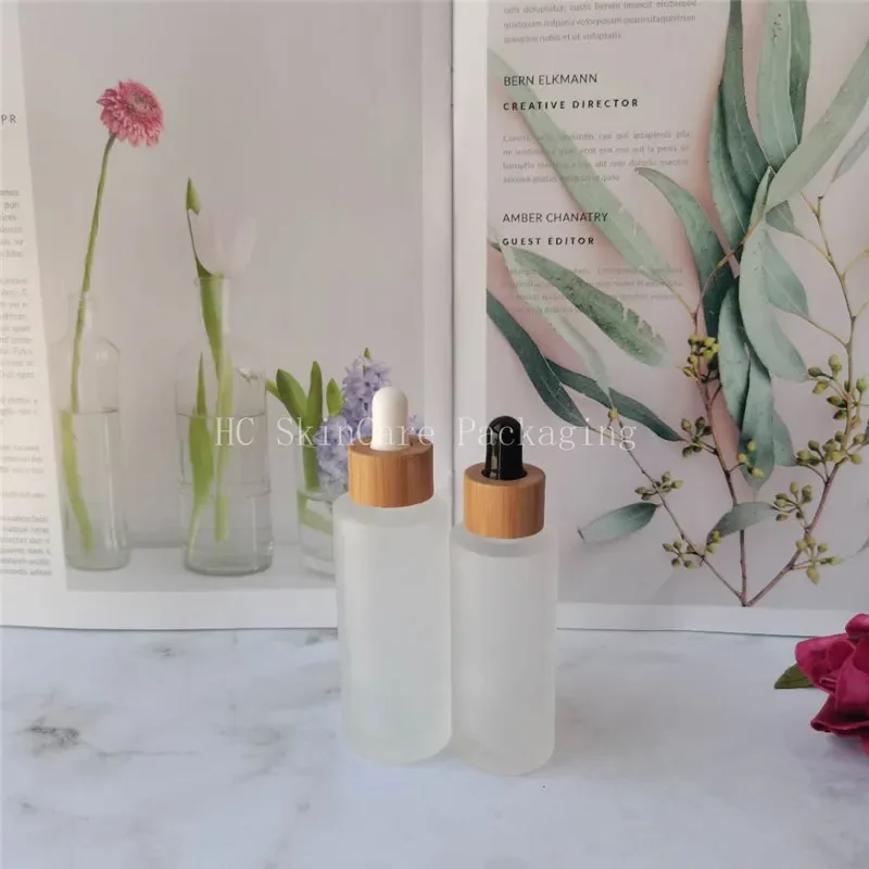 

Small Glass Bottles with bamboo caps Frosted Glass Dropper Bottle For Essential Body Oil Glass BottleBeautyContainerForCosmetics