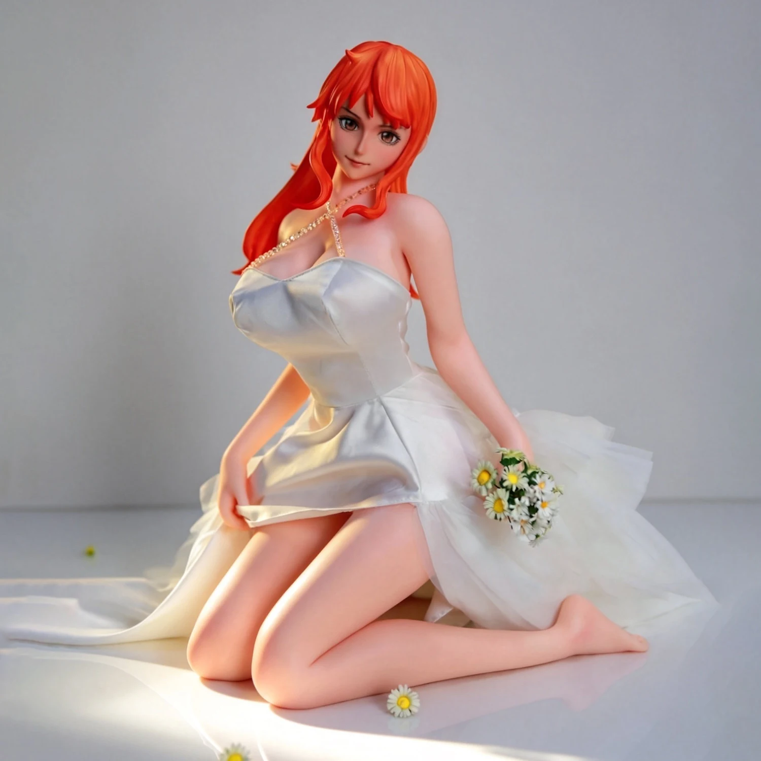 Nami figure An anime-themed collectible figurine with orange hair featuring two different facial expressions and made silicone