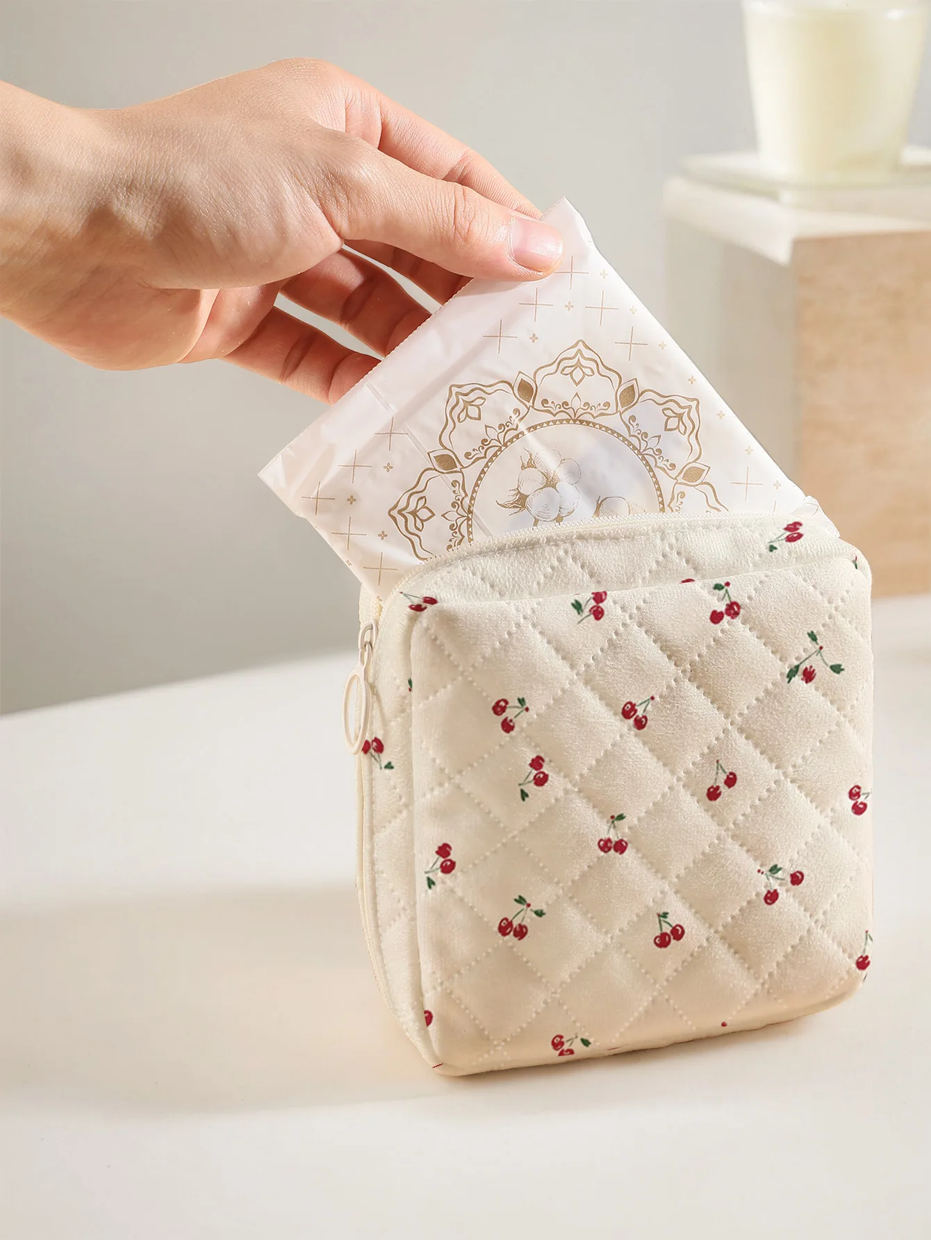 1 portable sanitary napkin storage bag, printed with tiny red cherries, diamond quilted fabric lightweight ladies tissue pouch