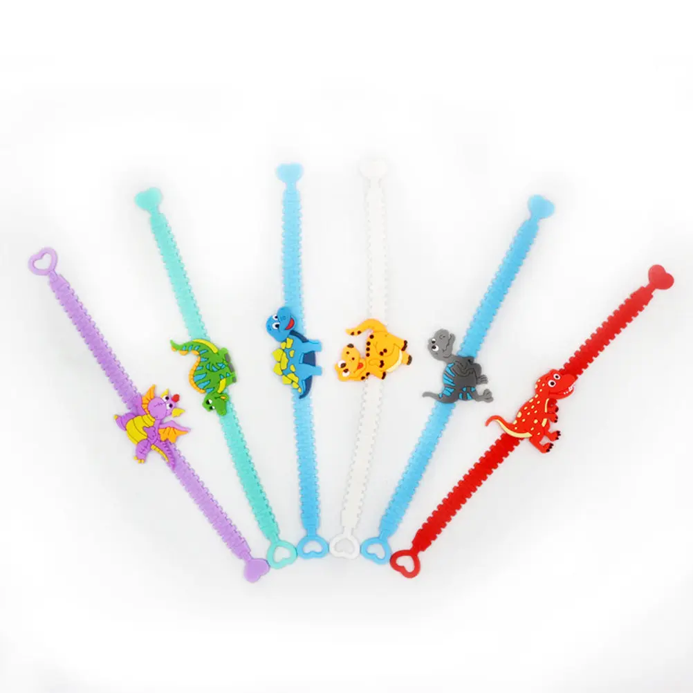 12Pcs Girls Dinosaur Bracelets Premium PVC Flexible Wristbands Safe Non-Irritating Party Favor Halloween Trick-Or-Treat
