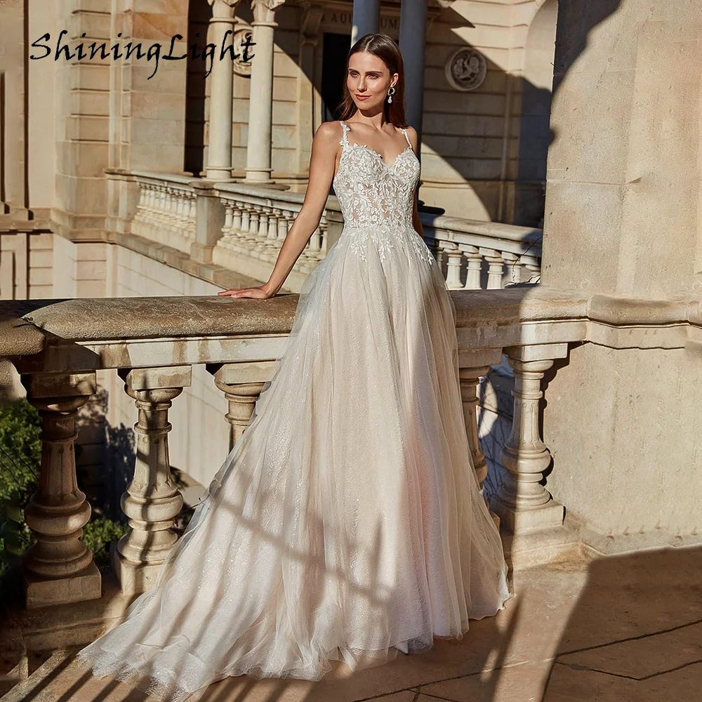 

ShiningLight Spaghetti Straps V Neck Wedding Dresses Lace Appliques Blackless Glitter Tulle A Line Bridal Gowns Customized