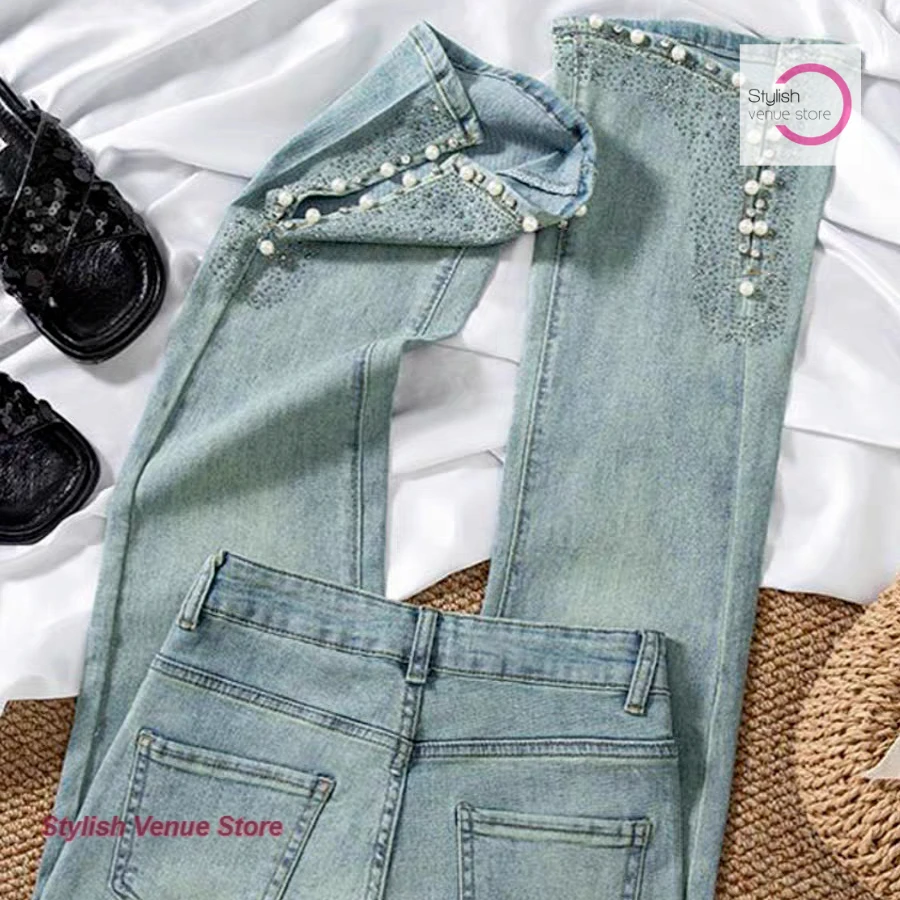 Korean-style fashion rhinestone denim flared pants women's autumn and winter new temperament split design high waist slim pants.