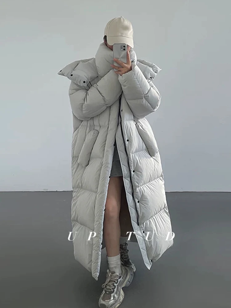 Casaco de Inverno Feminino Acolchoado Quente com Capuz 2026 Novo Casaco Longo de Pluma Coreano Solto de Algodão