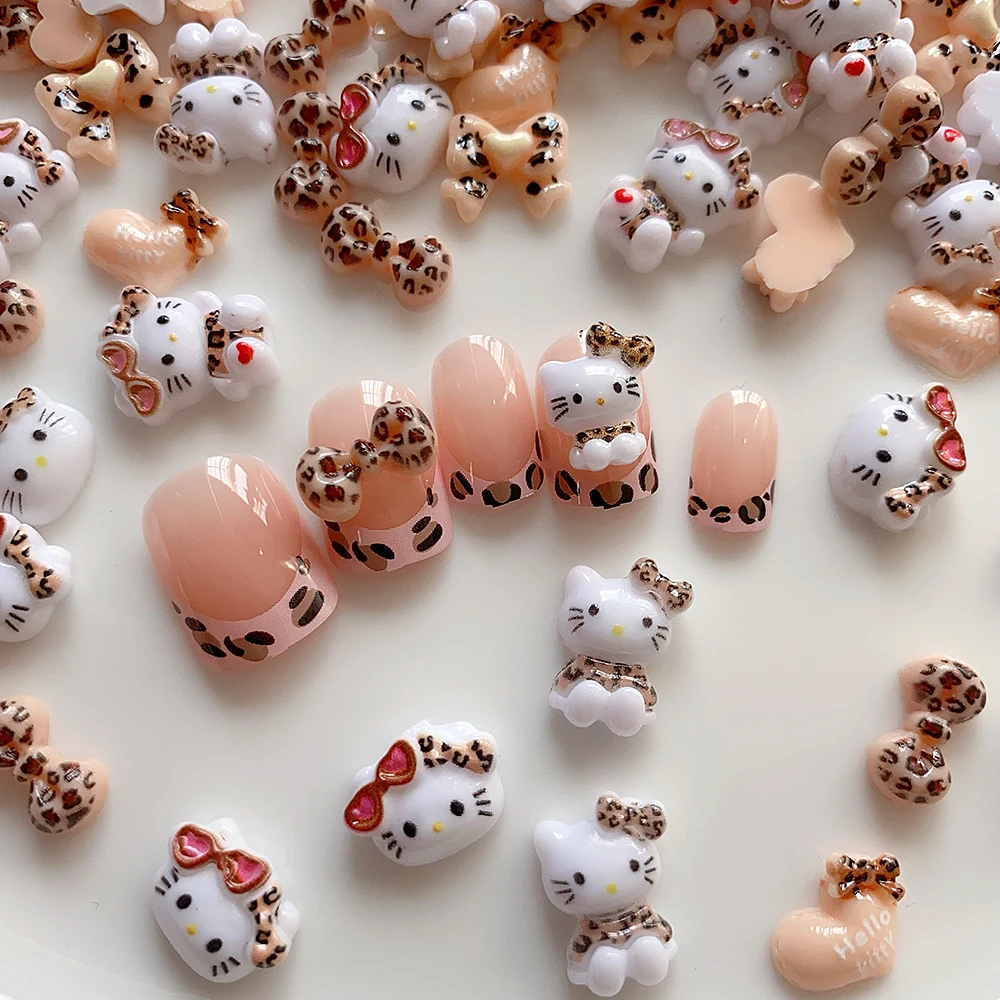 20pcs น่ารักเสือดาวแว่นตากันแดด Hello Kitty เล็บ Charms,ผสมเสือดาวพิมพ์ 3D ริบบิ้นโบว์อุปกรณ์เสริมการ์ตูนตกแต่งเล็บ