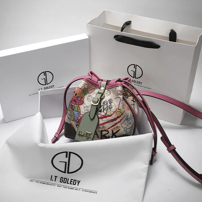 

Винтажная и роскошная сумка-ведро с уникальным граффити в виде мультяшного медведя и премиальной кожей, популярная женская сумка через плечо