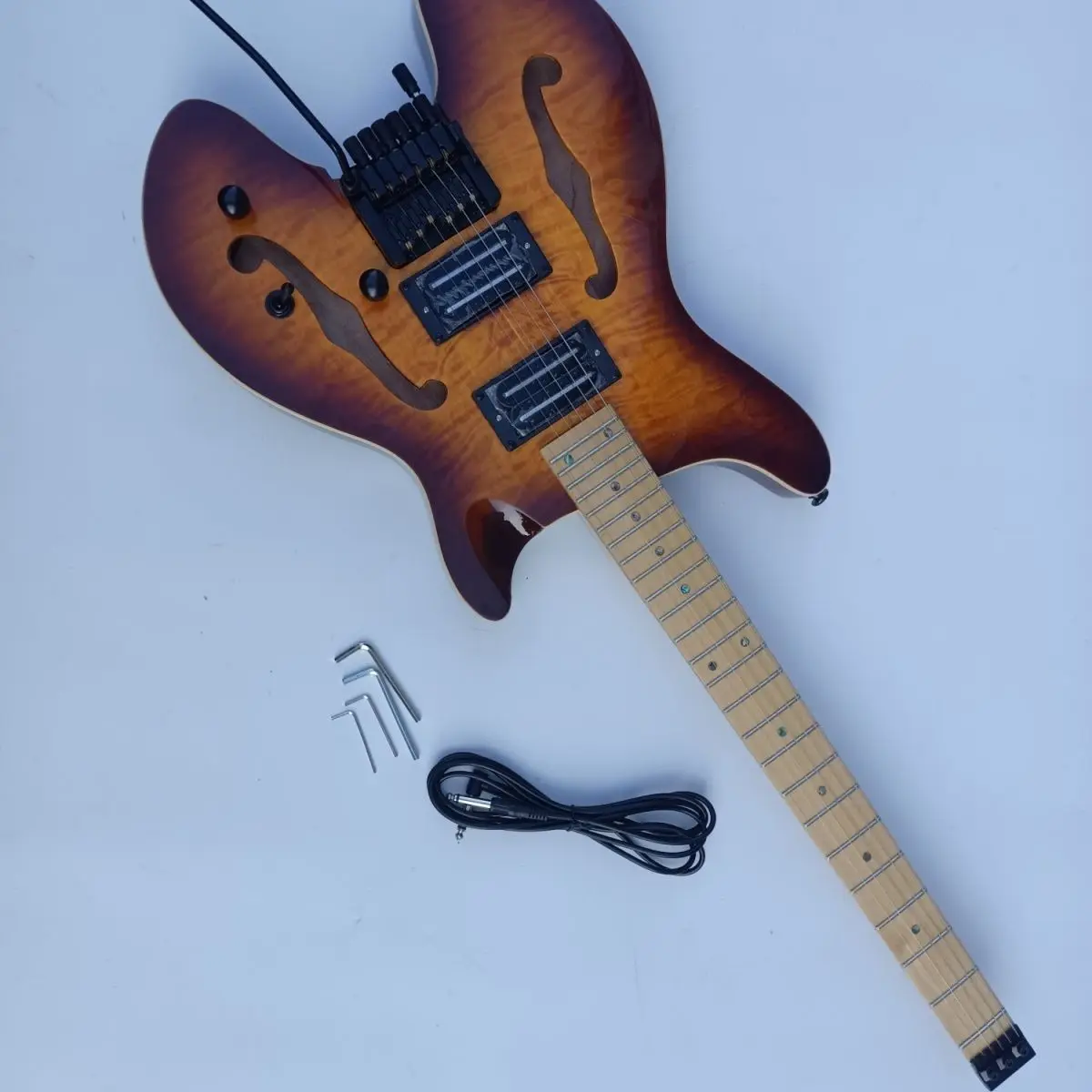 

Sunset color large pattern normal product headless electric guitar double f-hole effective chord length 648mm electric guitar