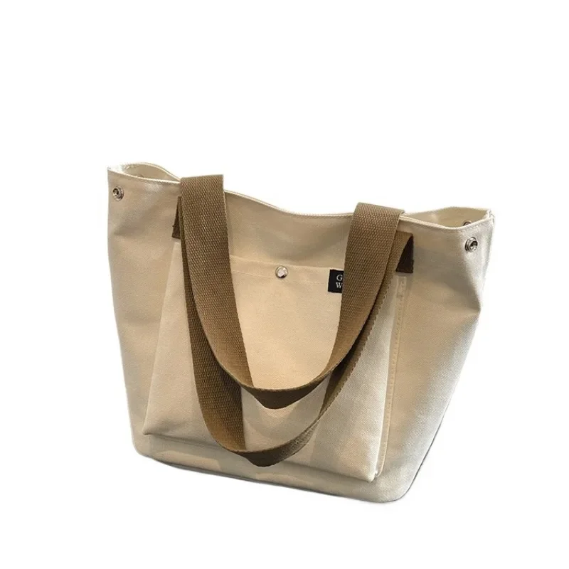 2025 جديد قماش بسيط سستة المرأة مصمم حقيبة يد شعبية بلون العصرية سستة عادية حسن المظهر حقيبة كتف