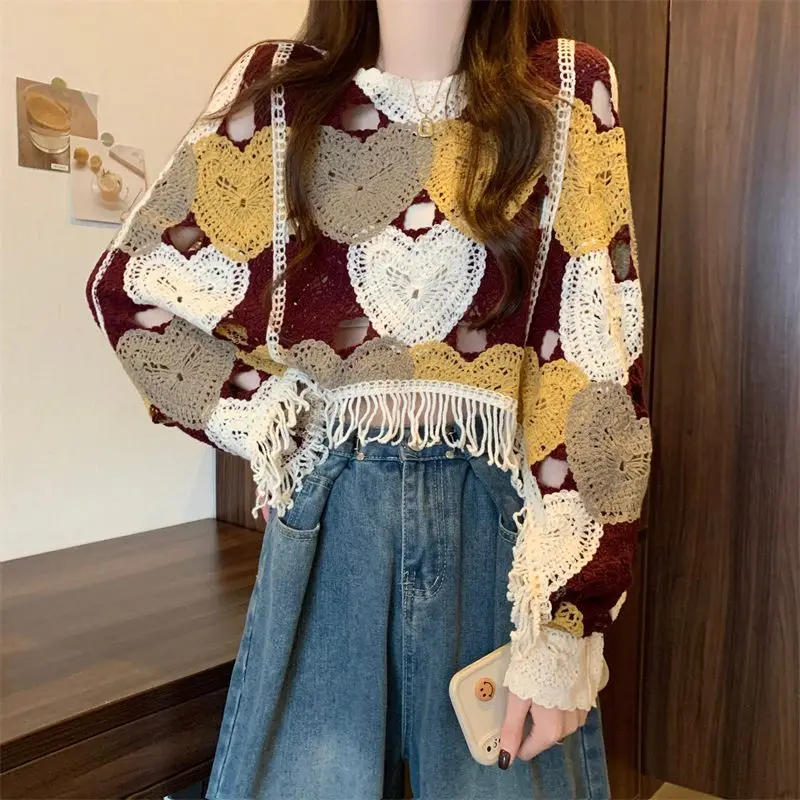 Koreaanse stijl ontwerp gebreide trui dames vroege herfst 2024 nieuwe gehaakte holle kwast losse en dunne top met lange mouwen