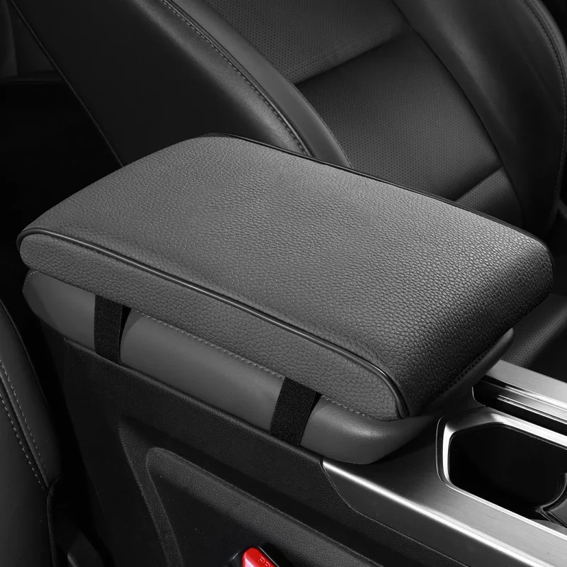 The new skin-friendly cowhide material leather memory cotton to increase the car armrest box mat advanced texture universal