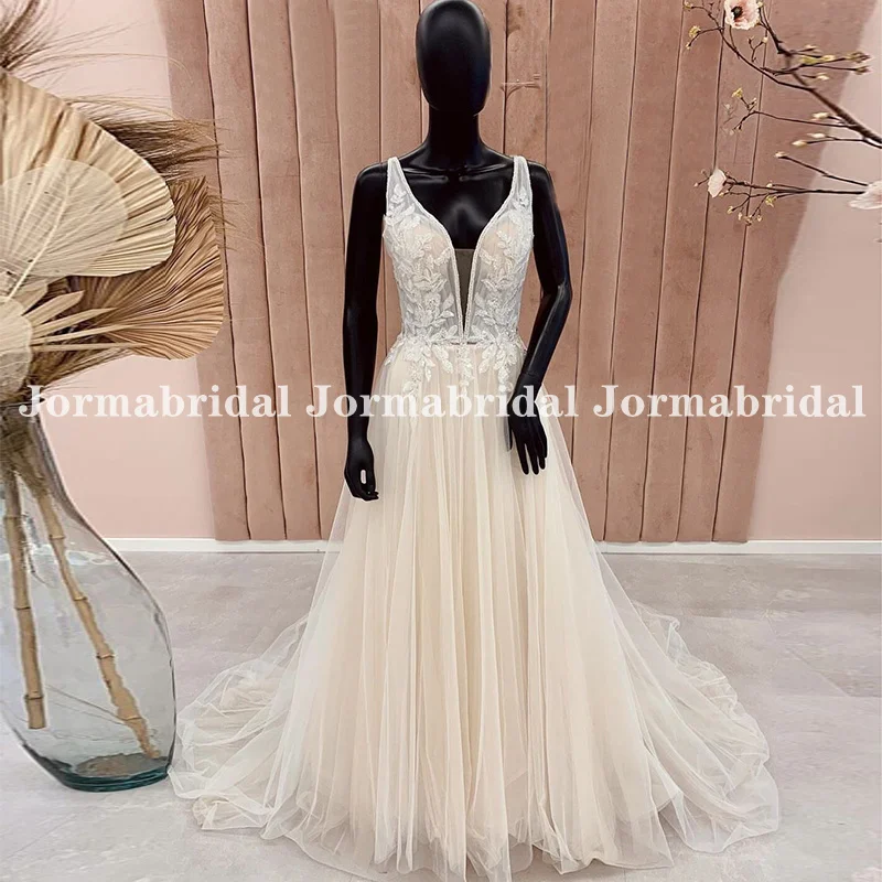 

Light Champagne Boho Wedding Dresses Illusion Bodice Appliques Plunging V-neck Flowing Tulle Wedding Gowns Open Back Bride Dress