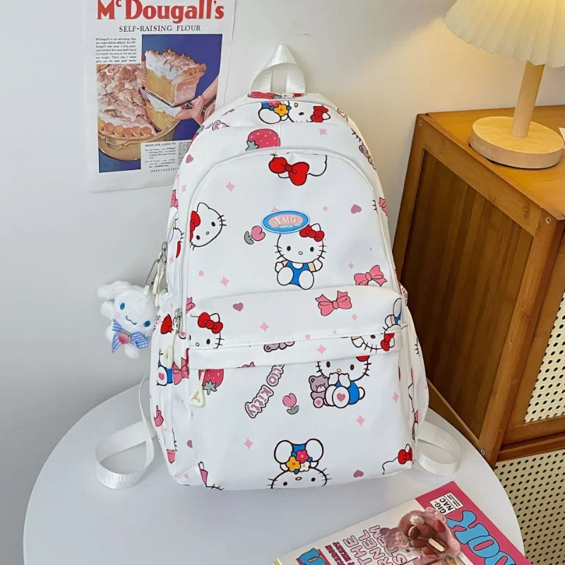 Sanrio-mochila escolar de Hello Kitty para estudiantes, morral impermeable de gran capacidad con bonito dibujo animado, ligera, con colgante de Jade para perro