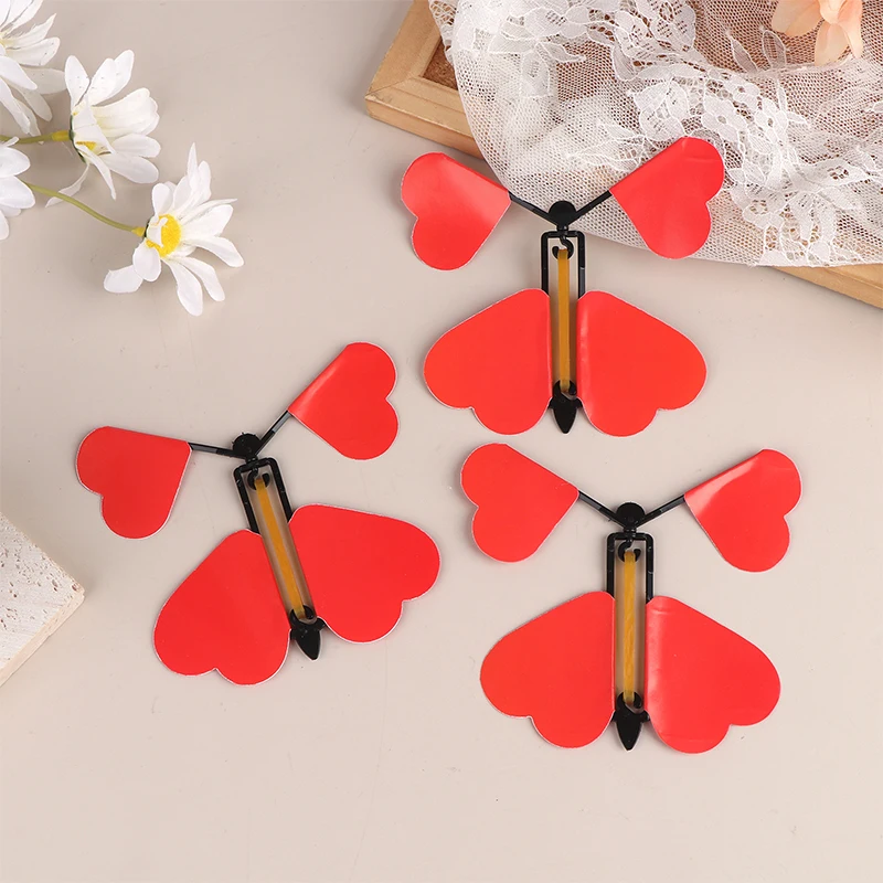 5/10/12 Uds. Juguete mágico de mariposa voladora, juguetes mágicos novedosos, banda de goma alimentada, trucos de magia de cuerda, juguetes, recuerdo de fiesta