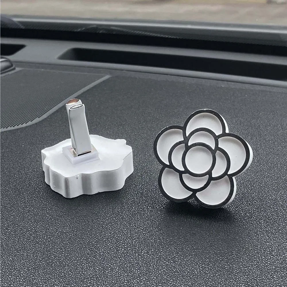 Juego de adornos aromáticos de Camelia montados en el coche, adornos aromáticos de salida de aire con aceite esencial de perfume para coche para eliminar el olor, 1 Uds.