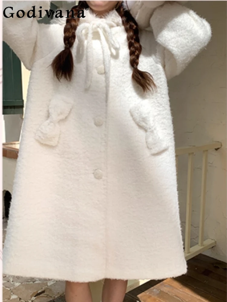 

2025 Autumn Winter New Cute Bow White Hooded Woolen Coat Fashion Women Versatile Fashion Loose Long Sleeve Elegant Sweet Coat