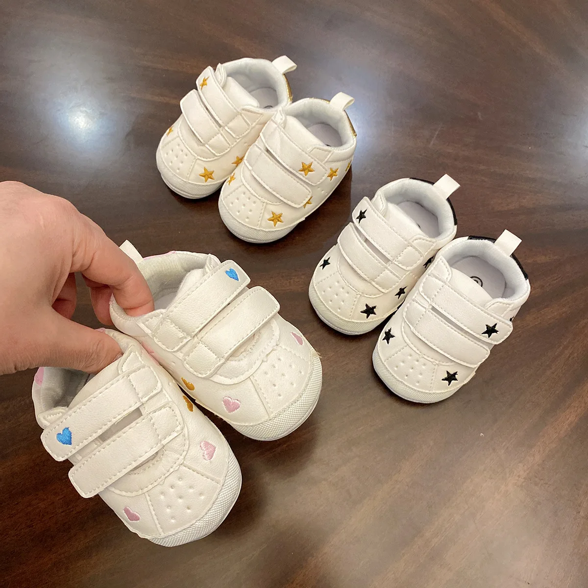 Primavera y otoño nuevo 0-1 año niño y niña bebé suela suave superficie suave zapatos blancos zapatos para niños recién nacidos