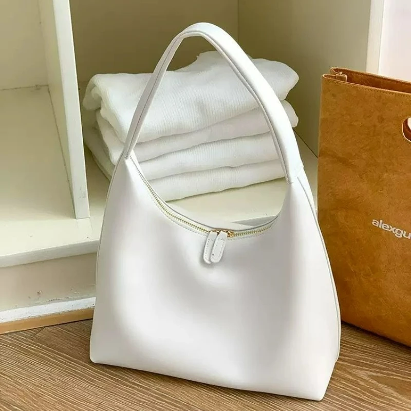 

Fashionable Simple Lightweight and Versatile Dumpling-shaped Shoulder Bag with Elastic Straps Double Zippers and Leather Handle.