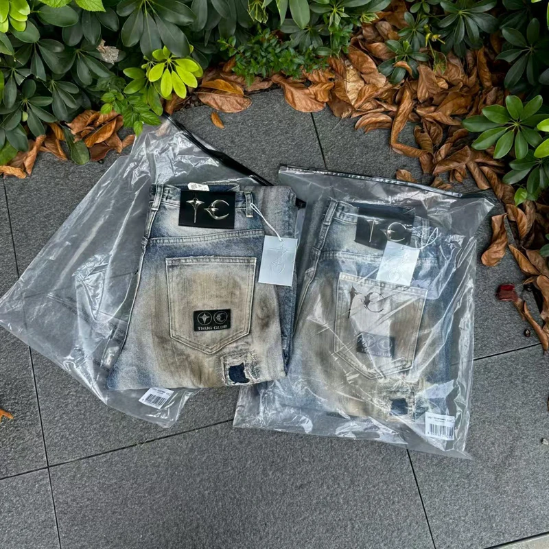 

Прямые свободные джинсы Soiled Thug Club Hole Damaged Messy Stitch для мужчин и женщин, высококачественные кожаные брюки со звездой и луной с металлической этикеткой