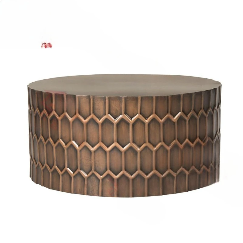 Modern light luxury round honeycomb, grain fiberglass coffee table, retro copper color in the living room