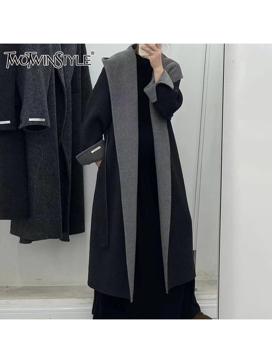 TWOTWINSTYLE Solid Patchwork Sashes Chic Trenches For Women Hooded Long Sleeve Spliced Pockets Temperament Long Coat Female New