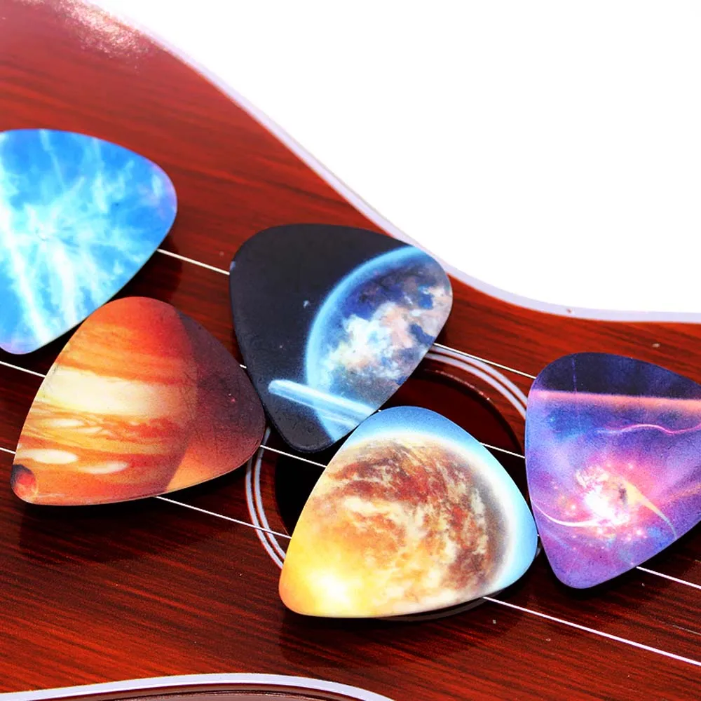 10pcs/Lot 0.71mm thickness Vastness of the universe Star guitar picks pattern guitar strap guitar parts Guitar Accessories